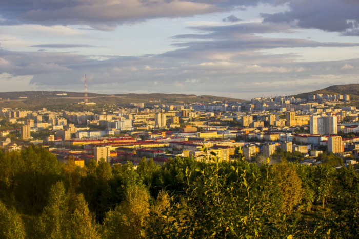 город