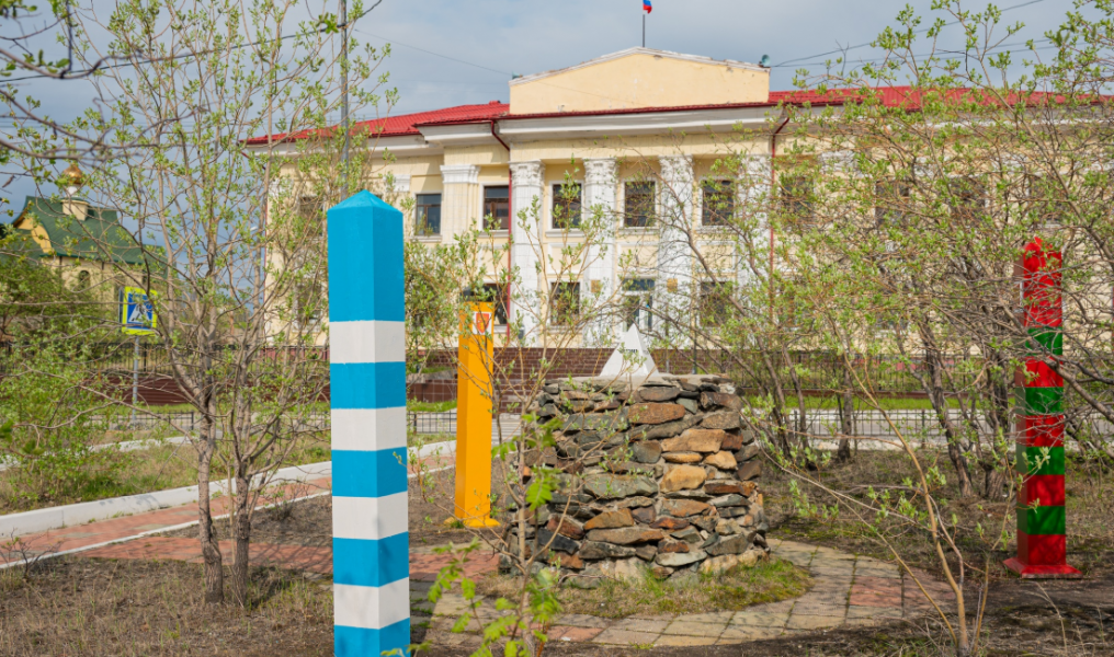 город